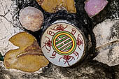 Bangkok Wat Arun - polychromatic mosaic flowers made from discarded ceramic pottery cut into petal shape. 